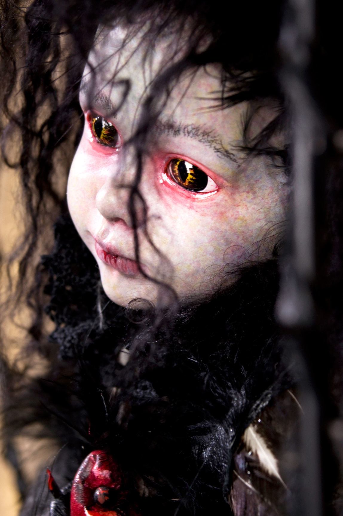 close-up pale gothic red rimmed eyes black hair doll repaint