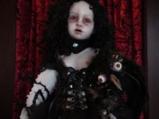 gothic art doll with black curls and leather