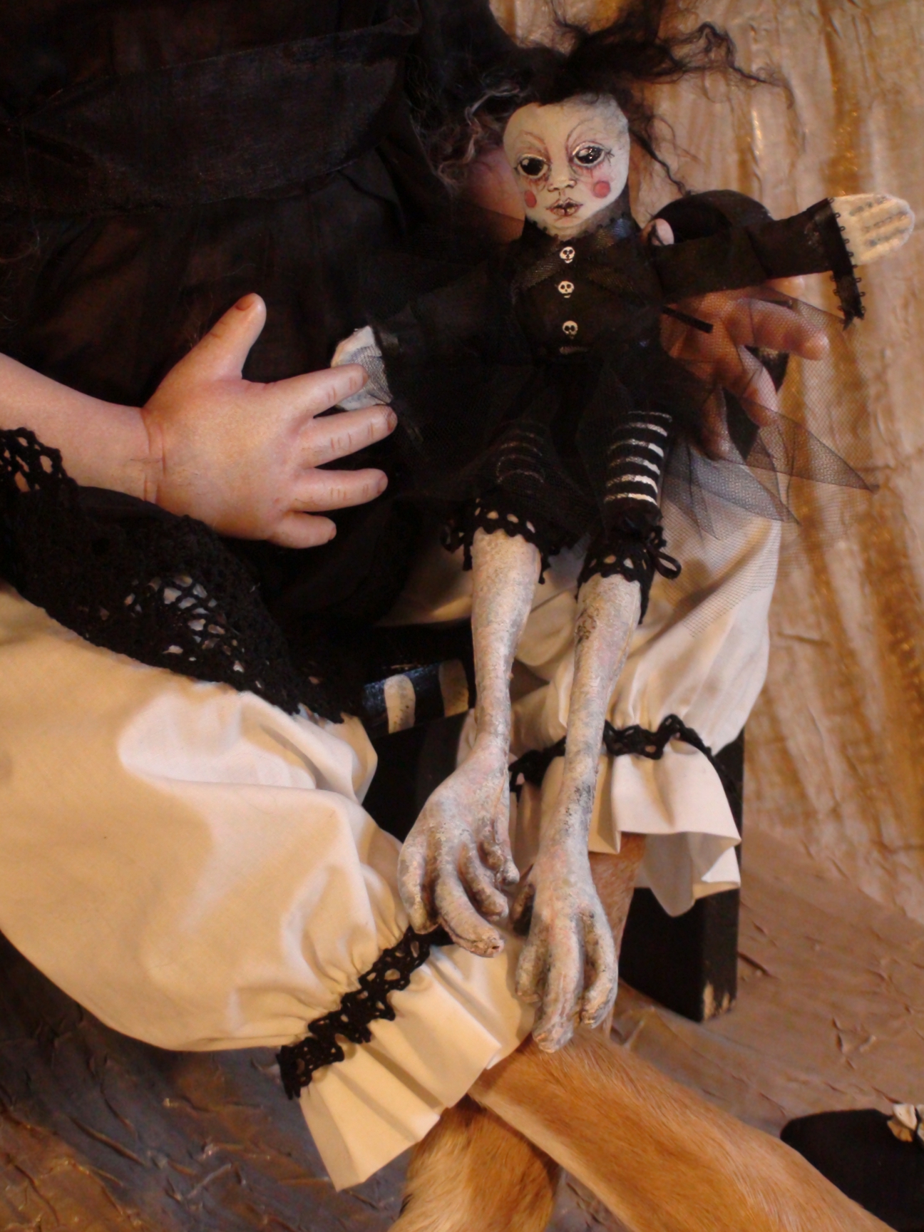 close-up of LucyDeer's lap with a handmade gothic cloth doll