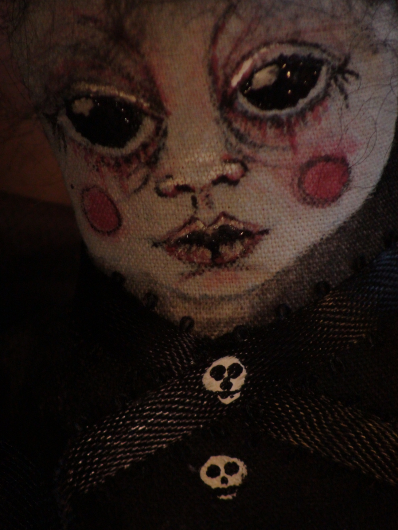 hand painted cloth doll face gothic with black eyes red cheeks skull buttons