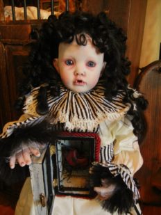 gothic repaint vampire artdoll porcelain doll with black ringlets and white black stripe ruffle collar and cuffs opens a cabinet to her heart in her torso