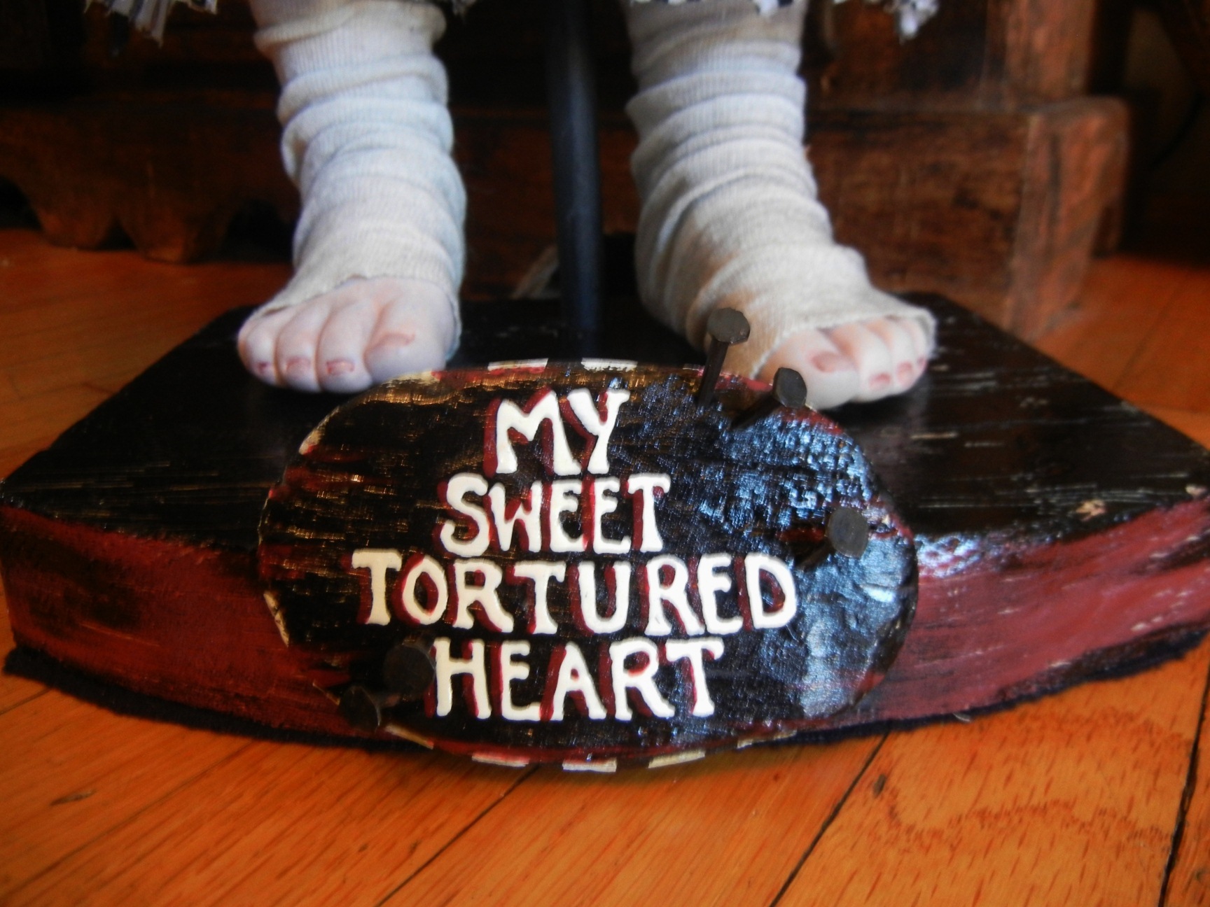 hand painted lettered wooden sign reads My Sweet Tortured Heart