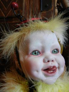 joyful porcelain babydoll head repaint blue eyes yellow feathers