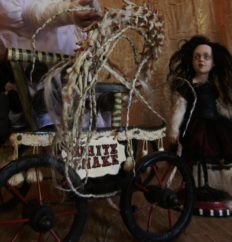 the Tremendous Responsibility circus-themed art doll with circus cart and snake bones