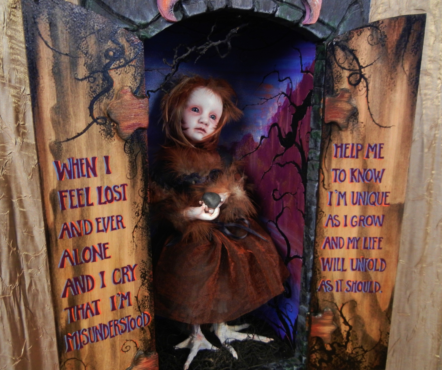 open mixed media cabinet reveals taxidermy artdoll assemblage wild doll with bird feet painted poetry on doors