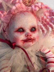 close-up face gothic repaint porcelain doll dark circus clown makeup with pink and white braids white tulle