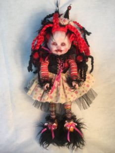 gothic repaint porcelain doll dark circus clown with bright red and black braids, party hat, striped and polka-dot dress and furry shoes