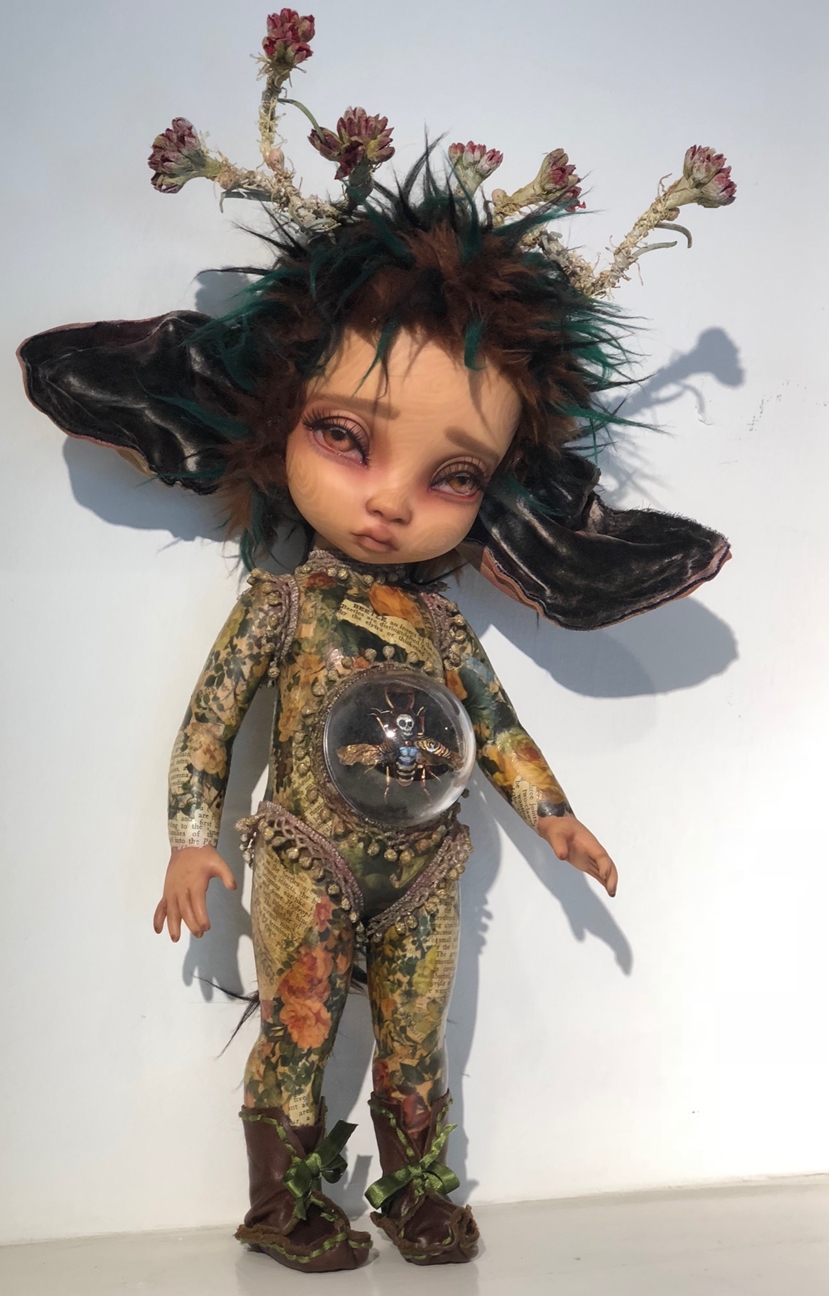 close-up gothic repaint fantasy mythical sprite doll decoupaged with colorful paper and trims big eared and acrylic belly with hand painted preserved beetle deathhead moth