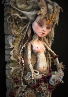 Mixed media assemblage repainted goth pagan doll