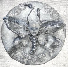 mixed media coaster art with silver death head moth