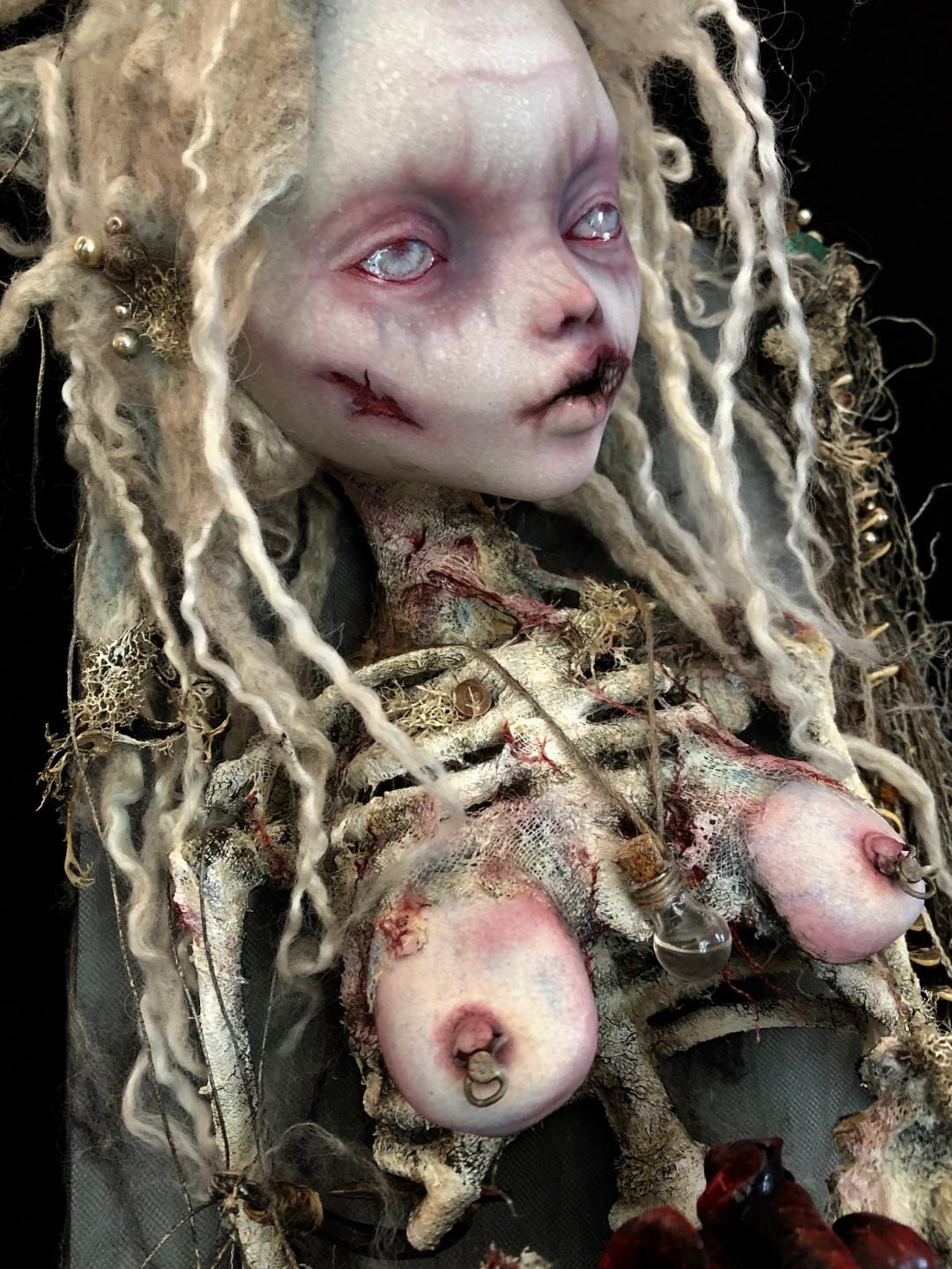 close-up of ghostly skeletal mermaid doll's face and ribcage goth doll repaint mixed media