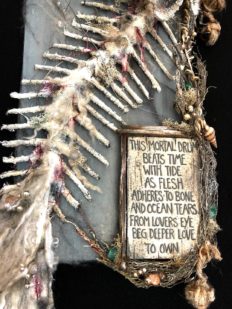close up of a skeleton mermaid tail mixed media poem hand painted on board