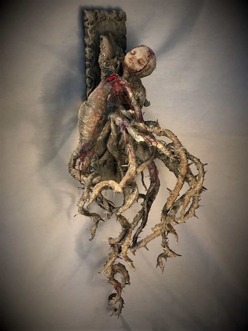wounded woman bleeding heart mixed media assemblage sculpture made of porcelain, cloth mache & wood