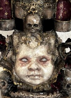 close-up hand-painted baby doll face part of mixed media treasure box by Stefanie Vega
