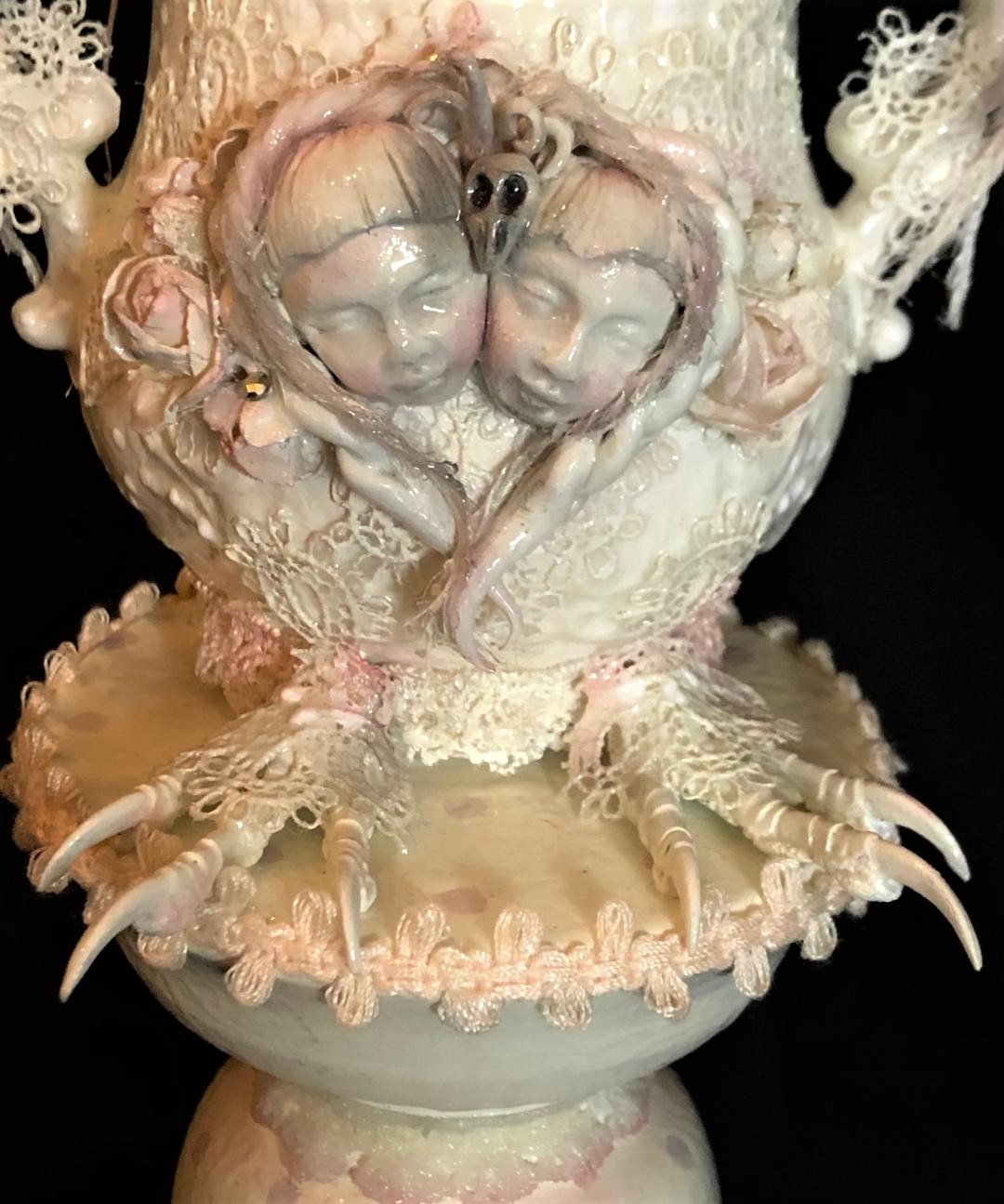 white rococo baroque mixed media assemblage vase with two faces and bird feet on pedestal