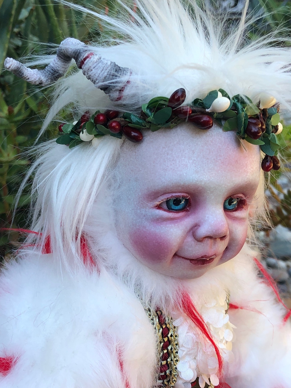close-up mixed media artdoll holiday elf girl wearing red and white velvet fur trimmed dirndl dress, floral crown