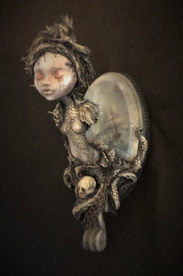 Mixed media sculpted assemblage of a haunting miniature ship figurehead with skull tentacles