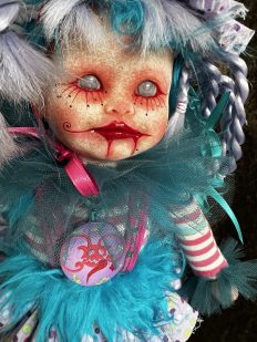 close up one of a kind purple and blue artdoll inspired by paintings of Michael Hussar gothic creepy clown ornament