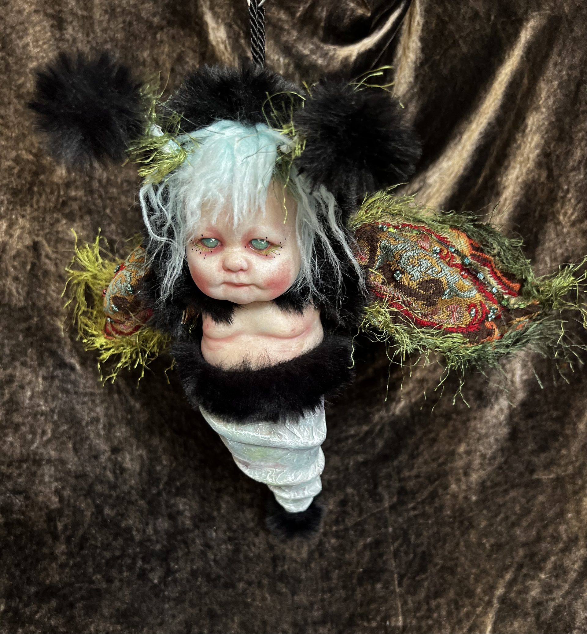 chubby babydoll moth hybrid art doll hand-painted with tapestry wings and black fur, light blue, red and green