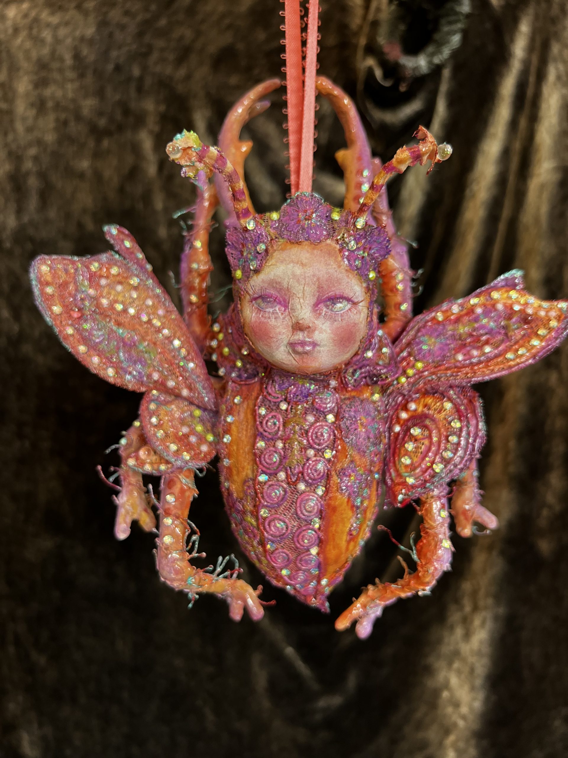 Papier-mâché pink and orange jewelled beetle ornament mixed media art