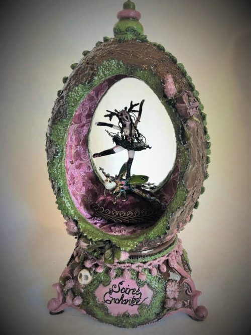tiny gothic dancer wearing skull headdress and black tutu spins atop a bejeweled beetle in a velvety purple moss-covered egg music box