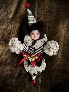 porcelain and wooden doll christmas ornament black, white and red