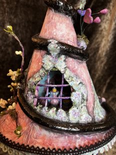 close-up peek through tower window miniature fairy house