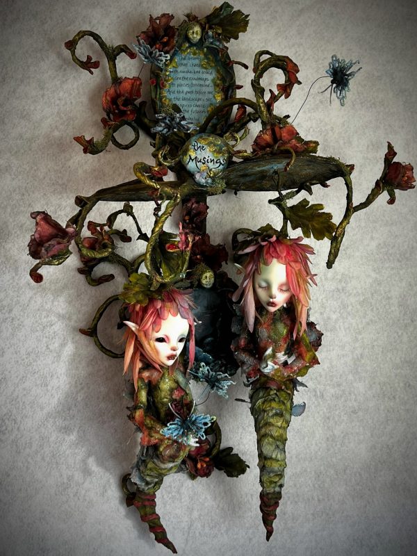 Mixed media assemblage of hanging twin flower fae with dreamscape and flowering vine