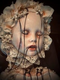 face close up of macabre, ghostly mixed media assemblage art doll repaint