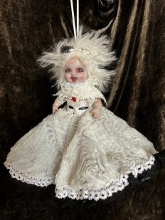 angel end of Topsy Turvy flippable doll with white hair and white lace dress
