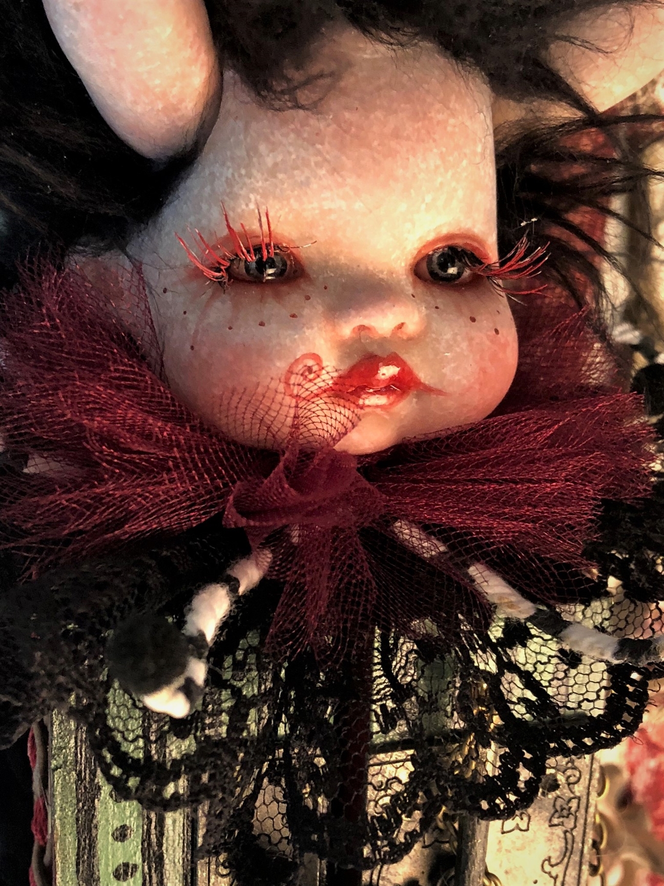gothic repaint porcelain babydoll head garish circus makeup and long lashes lace and tulle collar