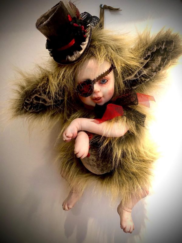 furry hybrid dog babydoll with brown fur, an eye patch and top hat