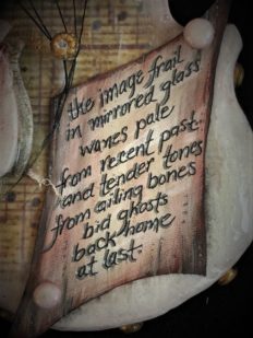 close up of a hand-painted poem on wood board