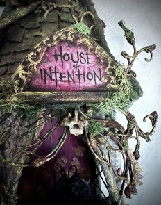 close up of name plaque on the mixed media assemblage House of Intention