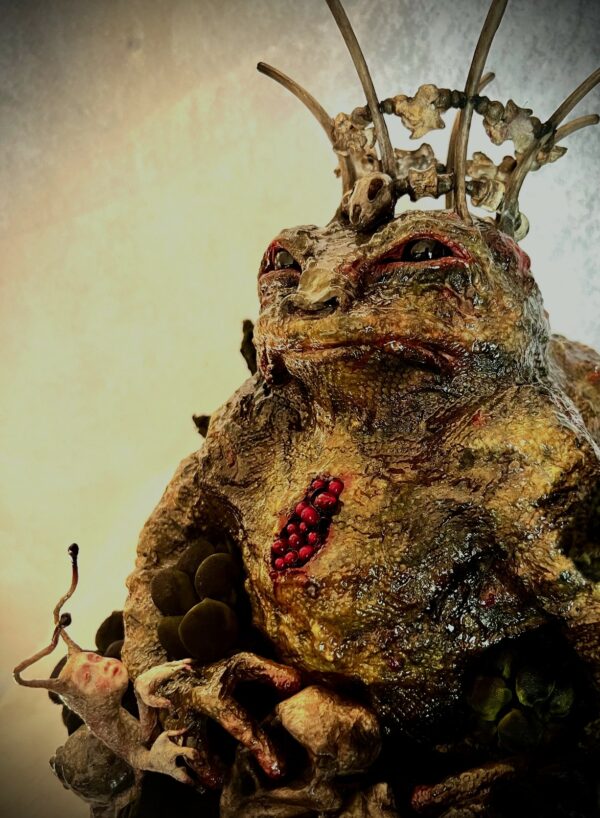 close-up Mixed Media Art sculpture King Toad corpulent toad wearing crown clay, paper, glass, wire, bones & shibori texture technique on vintage textiles