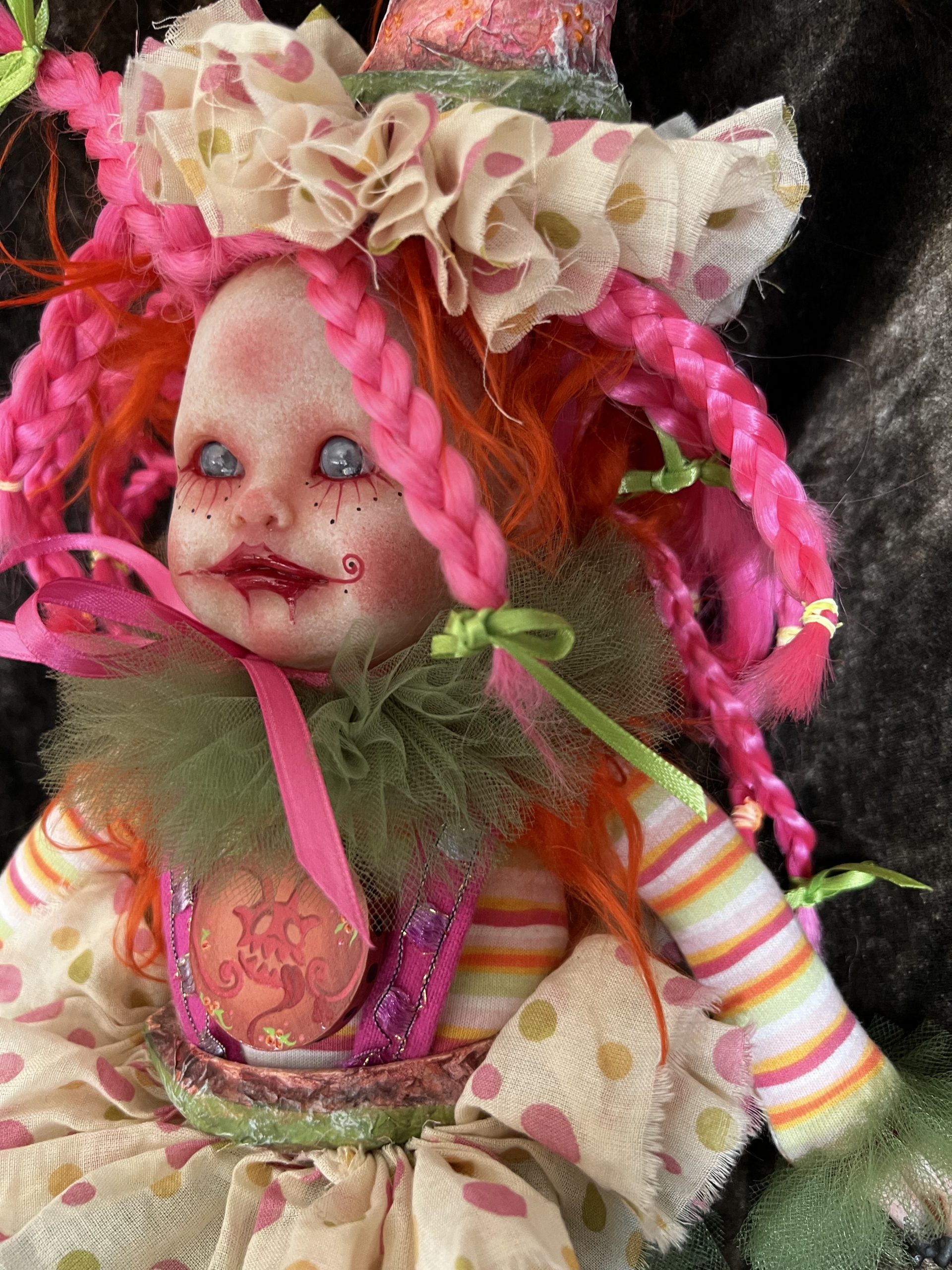 close up one of a kind pink and green artdoll inspired by paintings of Michael Hussar gothic creepy clown ornament