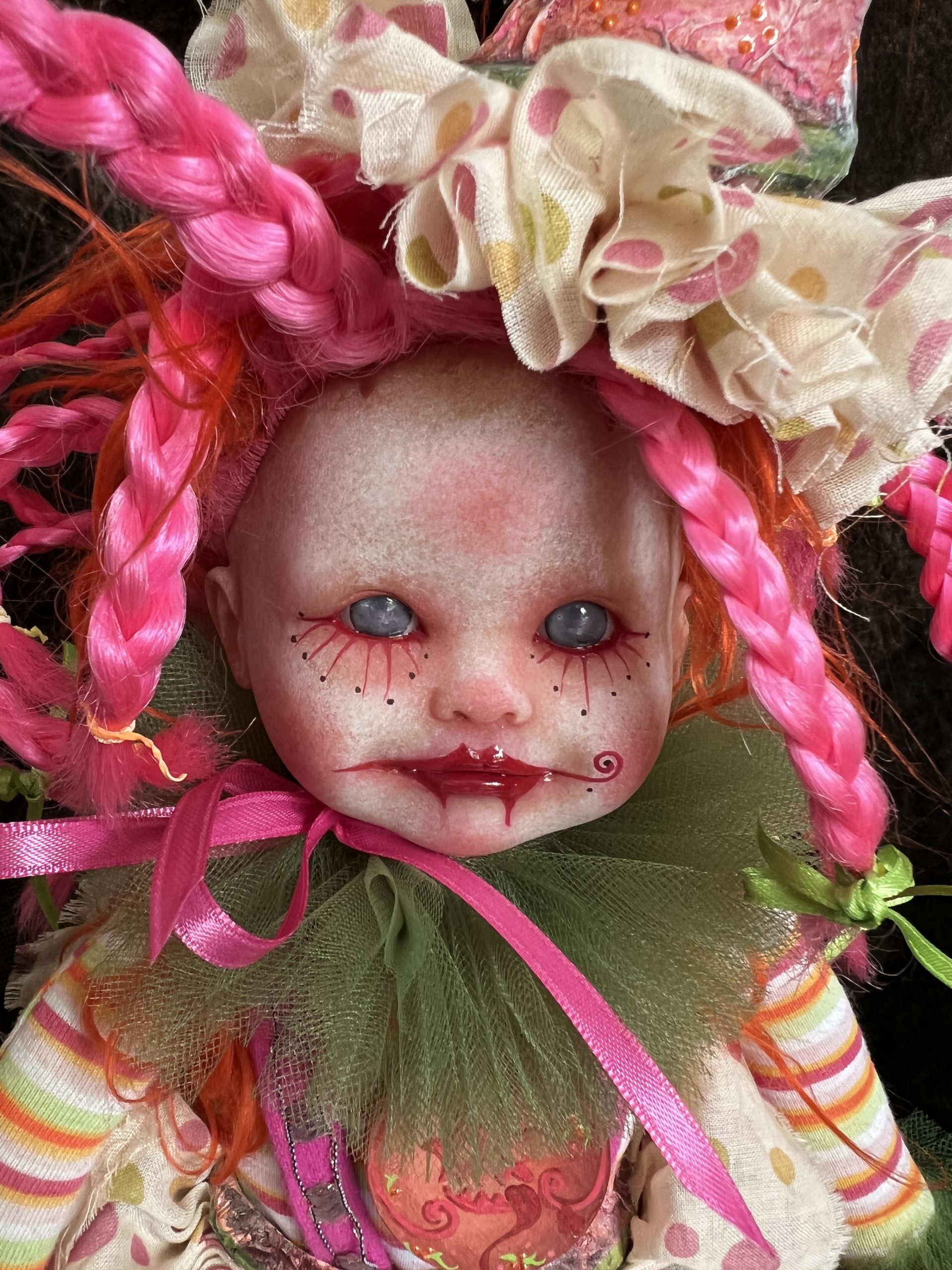 close up one of a kind pink and green artdoll inspired by paintings of Michael Hussar gothic creepy clown ornament