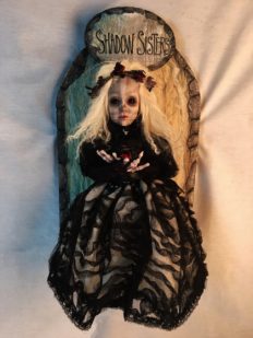 mixed media assemblage art doll goth repaint doll with blonde hair and skeleton makeup wearing black dress and red roses