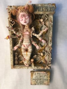 Mixed Media Assemblage Mounted on Wooden Board Queen Bee artdoll, bandage wrapped with third eye and six arms on honeycomb painted wooden board.