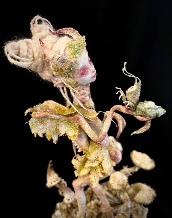 close up of The Queen one-of-a-kind art doll mixed media fairy creature with snail-like being