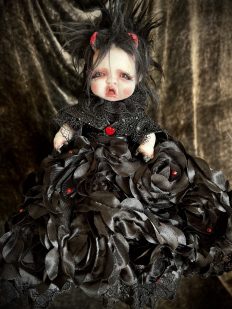 devil end of Topsy Turvy flippable doll with black hair and black lace dress