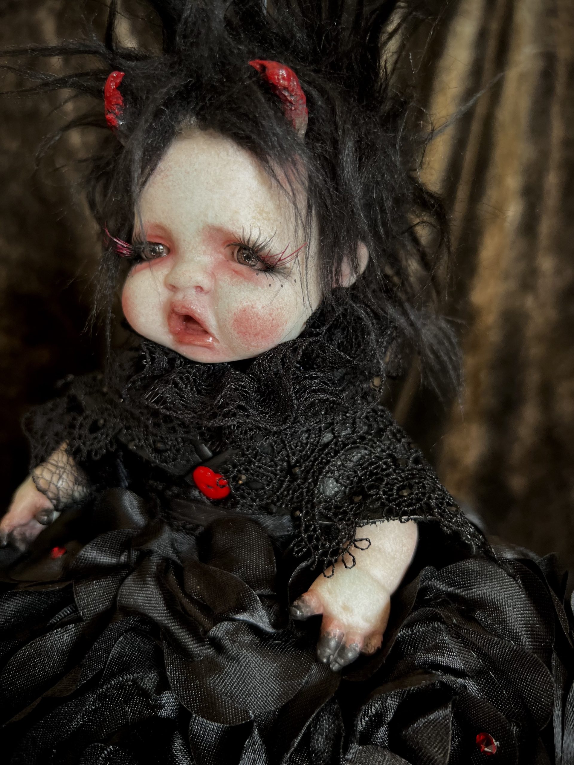 close-up of the devil end of Topsy Turvy flippable doll with black hair and black lace dress