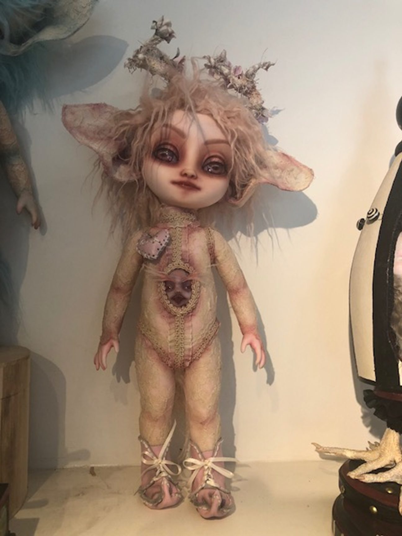 light pink gothic repaint fantasy mythical sprite doll decoupaged with antique lace and trims big eared and antlers a face in her belly
