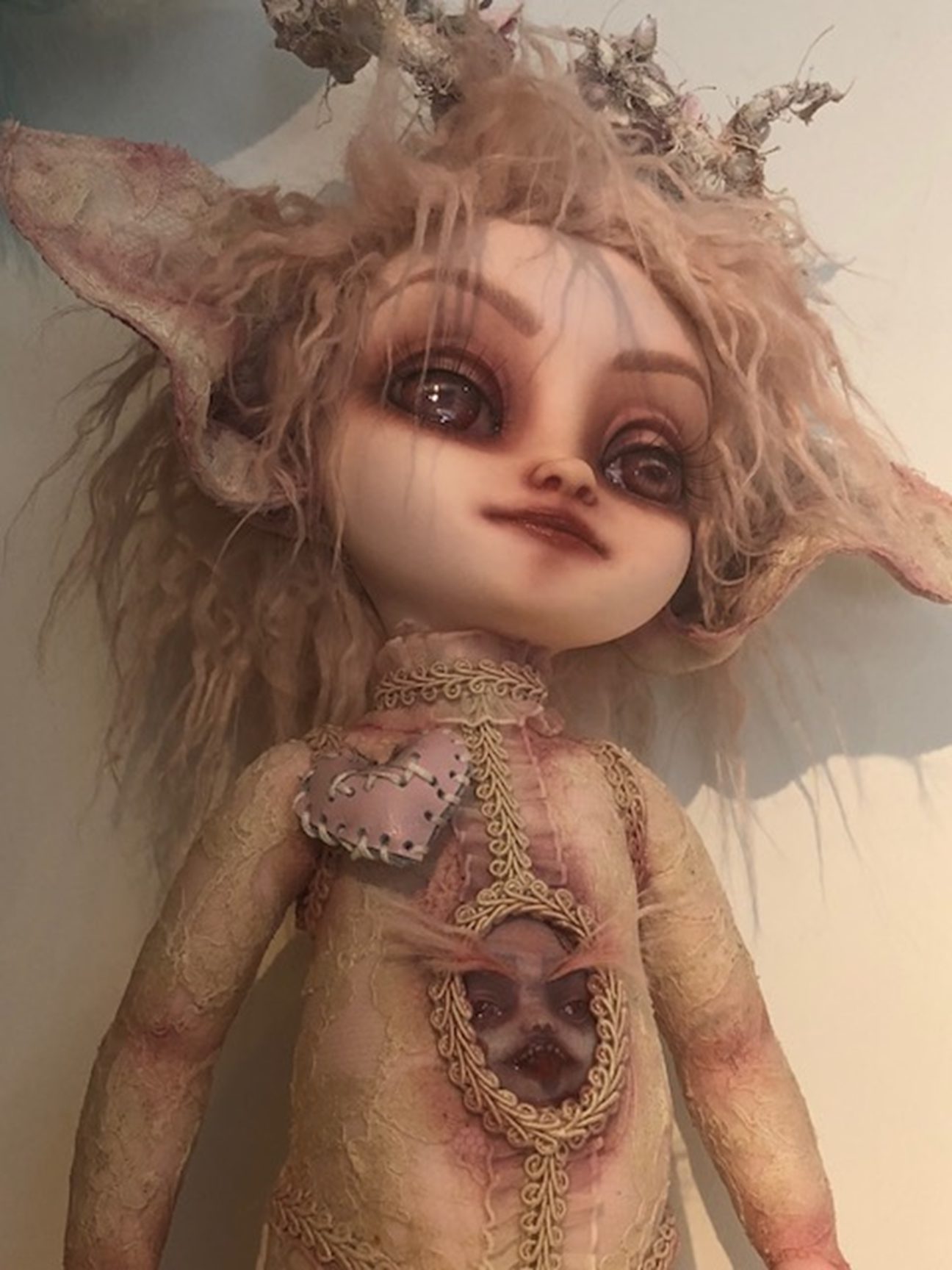 light pink gothic repaint fantasy mythical sprite doll decoupaged with antique lace and trims big eared and antlers a face in her belly