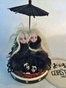 mixed media artpiece miniature conjoined twins sister artdoll gothic repaint blond hair, black dress, skulls on hand-painted wooden platform