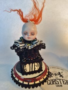 gothic babydoll head repaint wild orange hair, black and white ruffs, hand-painted red black and white wooden platform