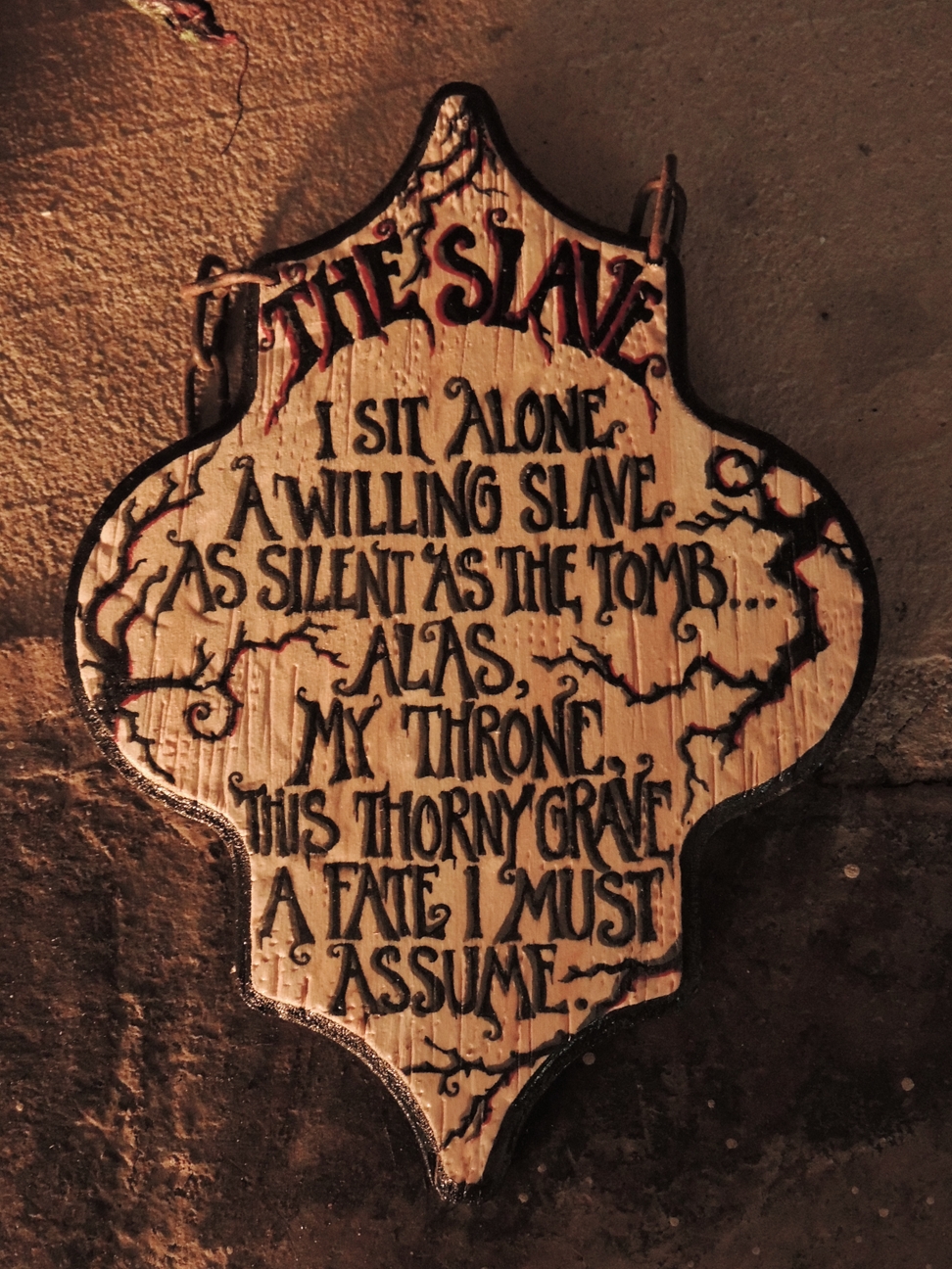 hand painted lettered gothic sign on wood with poem The Slave
